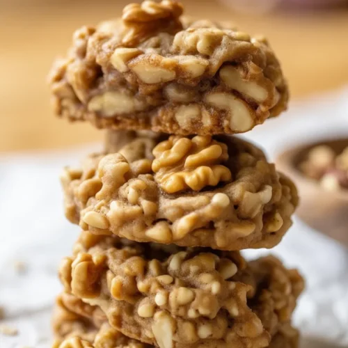 Healthy banana oatmeal cookies with chocolate chips and walnuts on a plate.