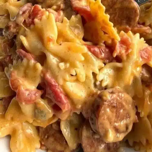 Delicious one pot creamy Cajun sausage pasta topped with herbs and spices.