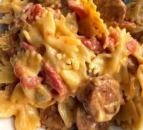 Delicious one pot creamy Cajun sausage pasta topped with herbs and spices.